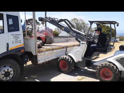 CL50 Multi Compact Loader Loading a KP60 Double Drum Compaction Roller
