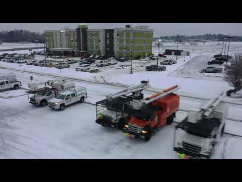 02-18-2021 Monroe, LA - Ice Storm, Power Poles Down, Line Workers Staging, Trees Iced Over, drone