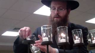 Lighting the Menorah and singing Chanukah song Glstonbury, C