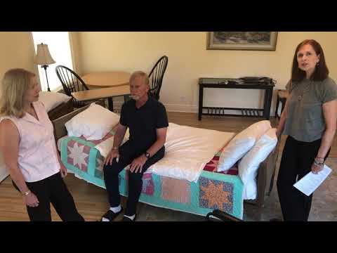 Transfer a patient from bed into a wheelchair with 1-person assist.