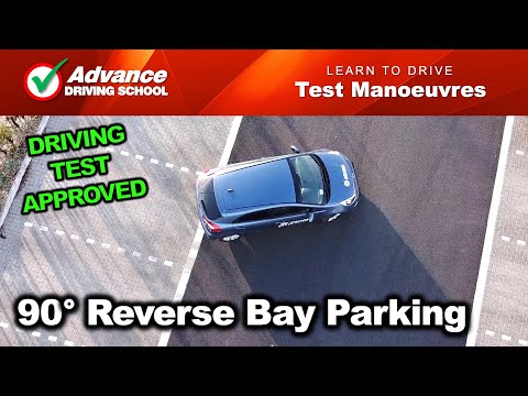 Part of a video titled 90° Reverse Bay Parking | 2021 UK Driving Test Manoeuvres - YouTube