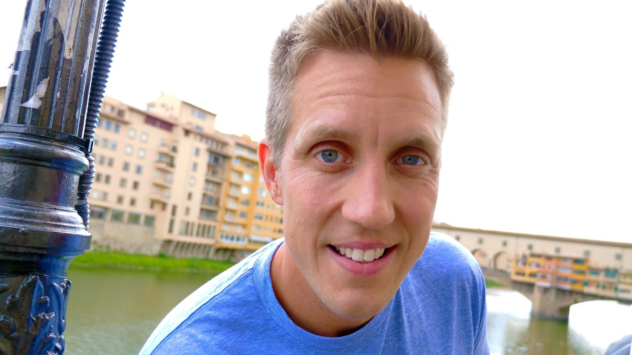 Experience the allure of Ponte Vecchio as a traveler explores it.