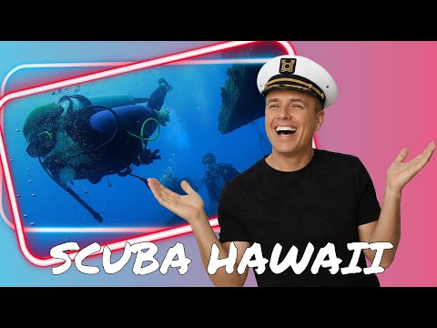 Divers descending toward the bow of the Sea Tiger wreck in Honolulu.