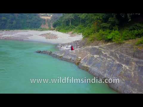 A couple celebrate their love along the Ganga above Rishikesh, negotiating rocks and sandy beaches