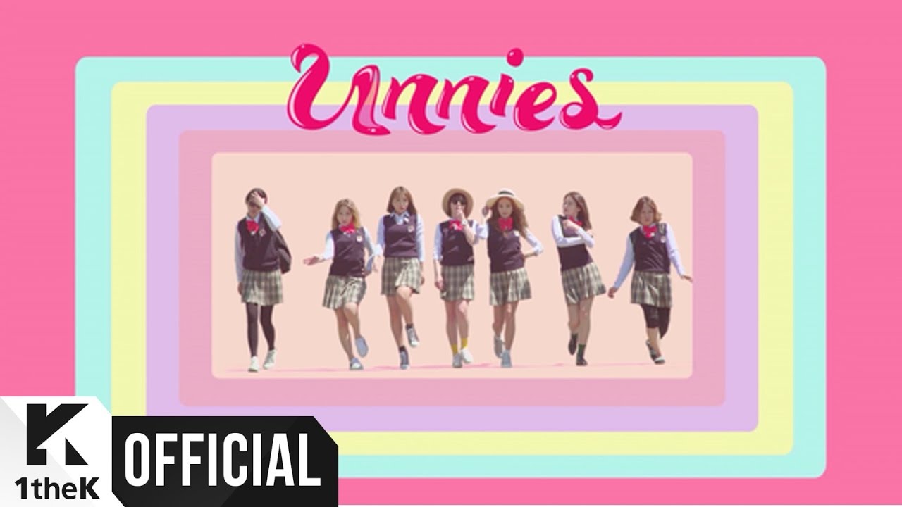 The seven members of Unnies in school uniforms on a pastel title card from the music video for “Right?” (맞지?)