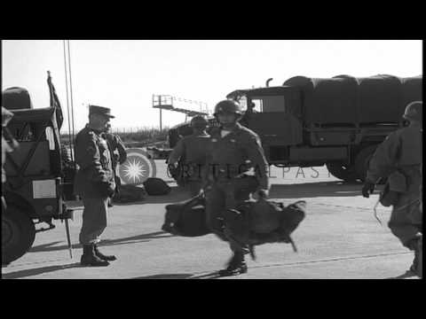 Soldiers of 101st Airborne division carry luggage as they move to board C-124 pla...HD Stock Footage