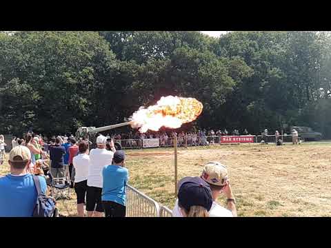 Naval cannon firing in slow motion.