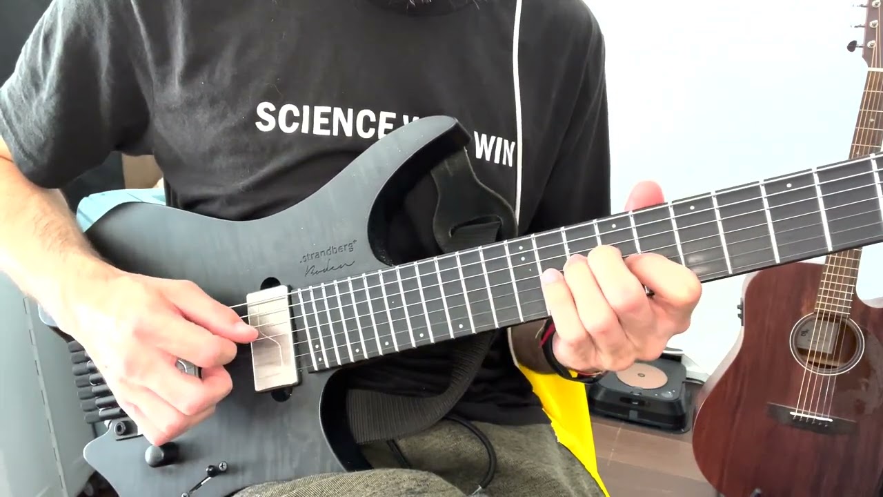Roberto Barlocci playing a sliding open string lick on electric guitar