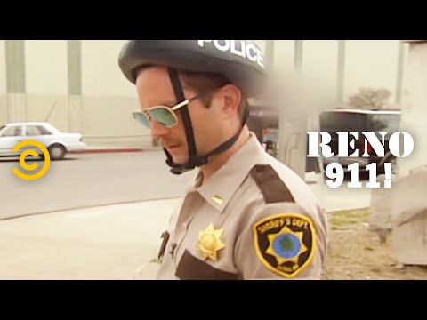 Literally One Hour of Lt. Dangle Trying to Get His Bike Off a Lamppost – RENO 911!