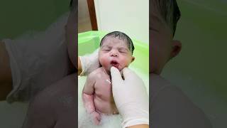 cute little girl first bath