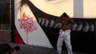 Chris Brown doing Karate Kicks in front of Kid Zoom Mural in LA