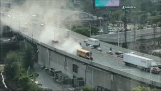 School bus shoots out clouds of smoke on Gardiner