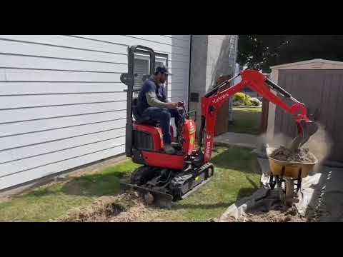 Excavating a yard for drainage installation