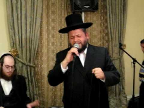 Chazzan Y.M. Helfgot singing by a party