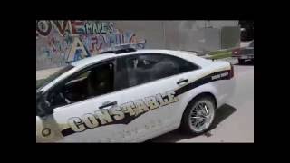 Paul Wall Swangin in the Rain (Paul Wall and friends ride with deck out Police car)