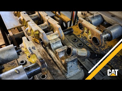 Part of a video titled Deep Dive: Wet Pin and Bushing Turn with Cat® - YouTube