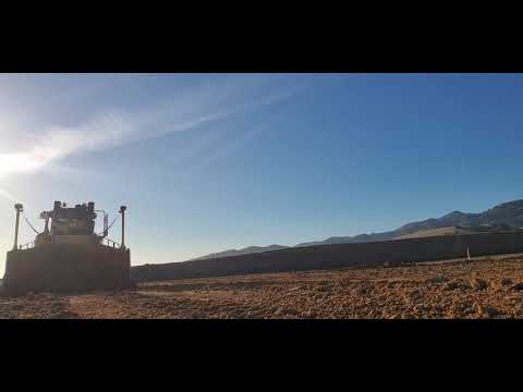 Caterpillar D8t with Trimble gps making a pass.