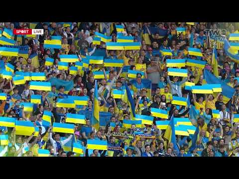 The Ukrainian players and fans sing their national anthem at Hampden Park. 🇺🇦