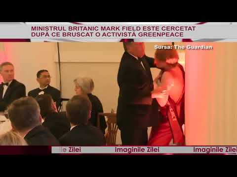 Imaginile zilei 21 Iunie - Ministru britanic surprins când bruschează o activistă Greenpeace