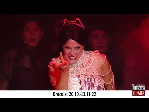 Close-up trailer still suggesting Mina and Dracula across a moonlit backdrop