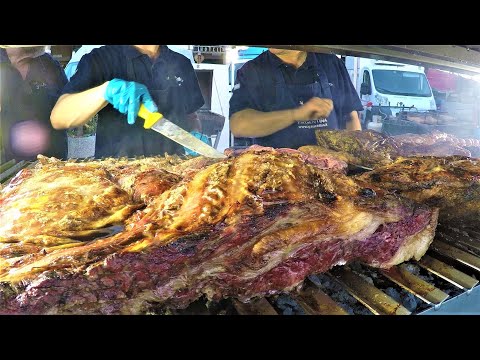 Street Food Festival in Italy. Grilled Meat, 'Porchetta', 'Lampredotto', Pork Legs, Loin, Sausages