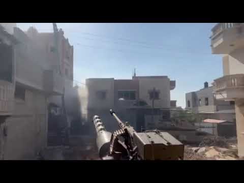 Merkava fires its coaxial 7.62 FN MG recon fire in the Gaza Strip
