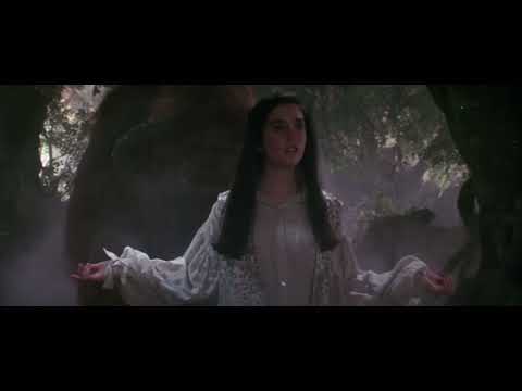 Official trailer collage: Sarah faces Jareth, goblin revels cut against Escher-like stairs and the ballroom