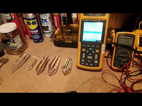 Quartz crystal piezoelectric output comparison