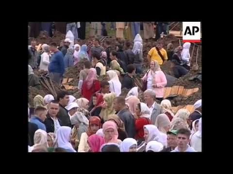 WRAP Relatives arrive for memorial service for hundreds of victims ADDS mourners