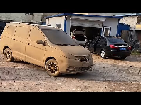 Hard working girl washing a dirty van.Very satisfying process.