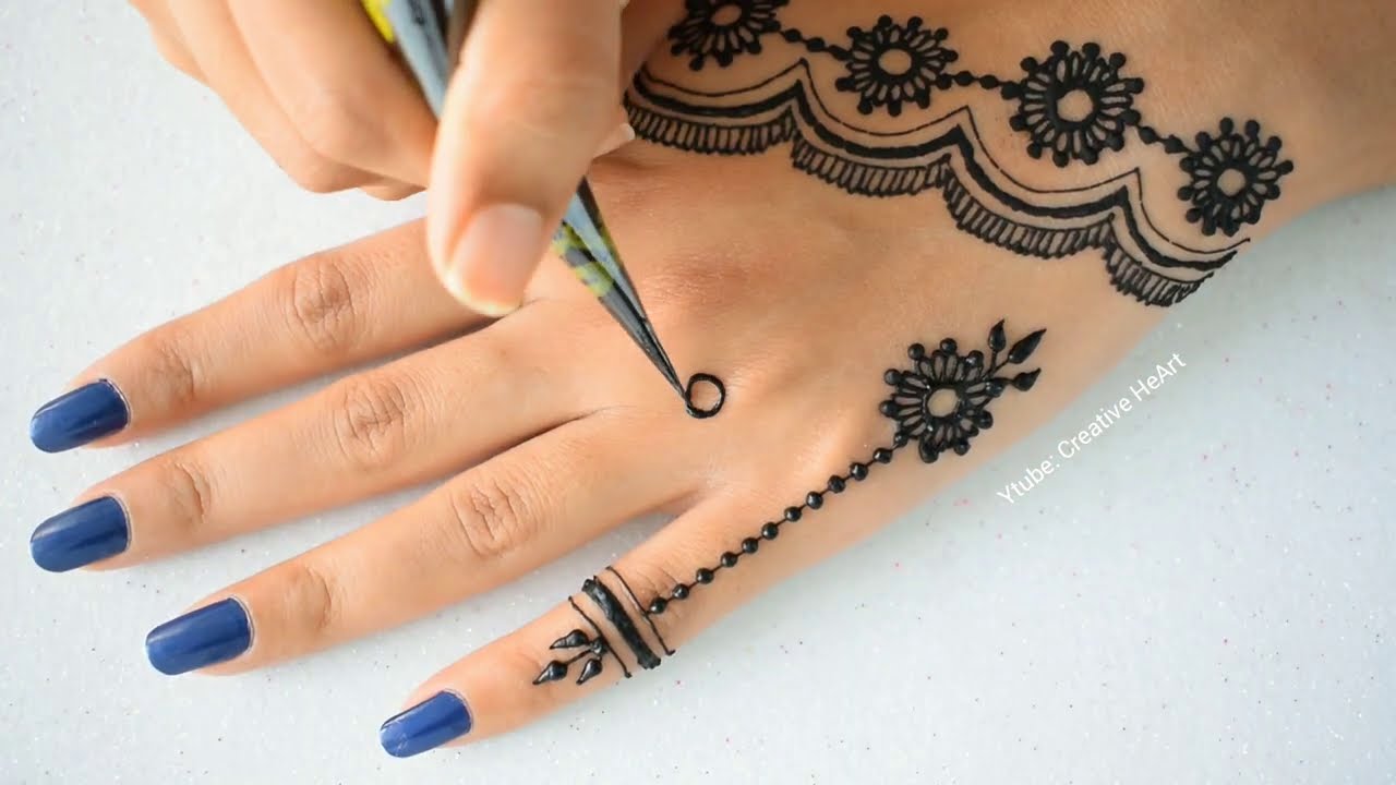 new stylish back hand mehndi design by creative heart