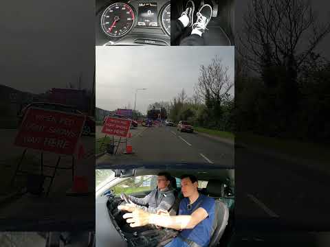 Car stopped beyond temporary traffic light stop sign