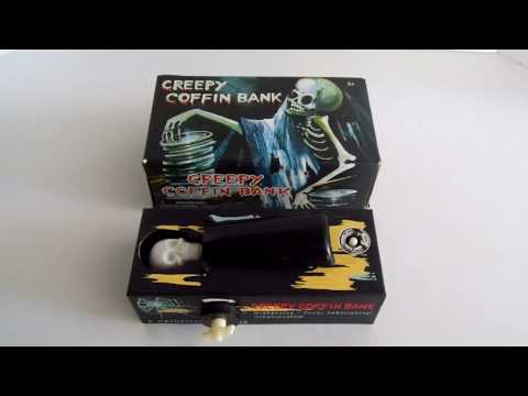 Skeleton Coffin Bank Grabs Money