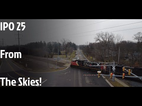 CN's IPO25 SD70M-2 from the skies + A meet with Amtrak 350!