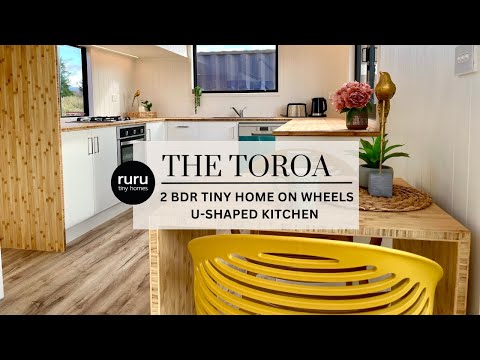 Ruru Tiny Homes: The Toroa - double storey two bedroom tiny home on wheels - U-shaped Kitchen