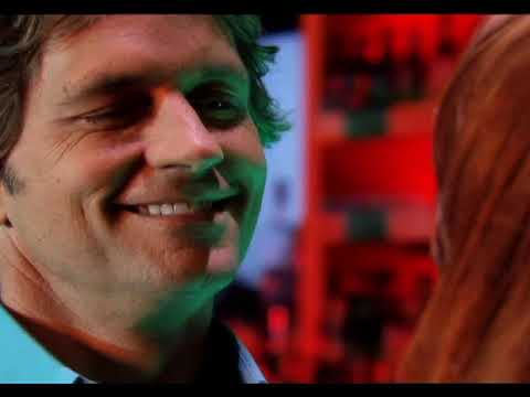 Trailer montage of city lights and close-ups underscored by Latin pop instrumentation