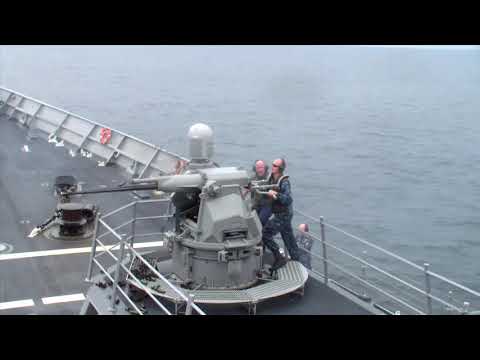 Gunners Mate Manually firing the 25mm (MK-38)