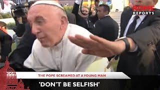 A man almost makes the Pope fall on to a person in a wheelchair