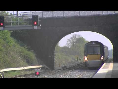 Irish Rail 201 loco 219 + mk4 set 4002 passes and 22033 arrives at Kildare