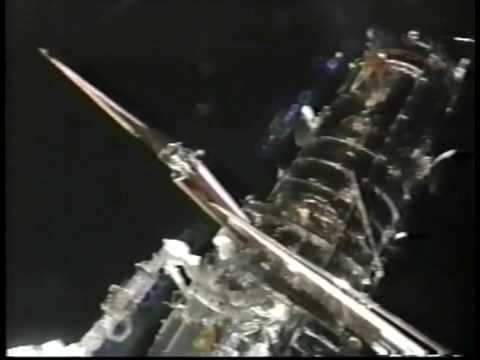 NASA STS-61 UFOs zoom by spacewalkers!
