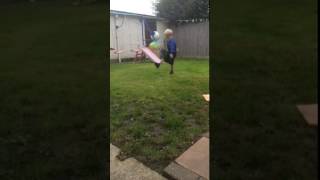 kid tries to kick a football but hits his face instead