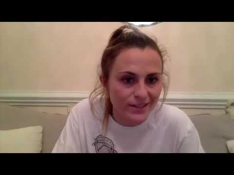 Duke Goalie Sophia LeRose giving practice tips to a young goalie