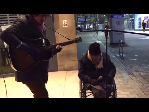 Pictures that move you to tears: Homeless wheelchair user drives to street musician
