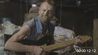 Richard Dormer plays guitar on the set of Writer/Producer Simon Allen's The Watch