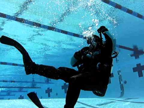 Dry Suit Diver - One technique for handling excess gas in the legs of a dry suit