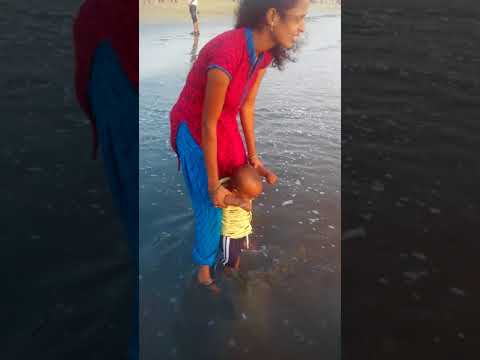 saharsh playing in sea water at mumbai zuhu beach