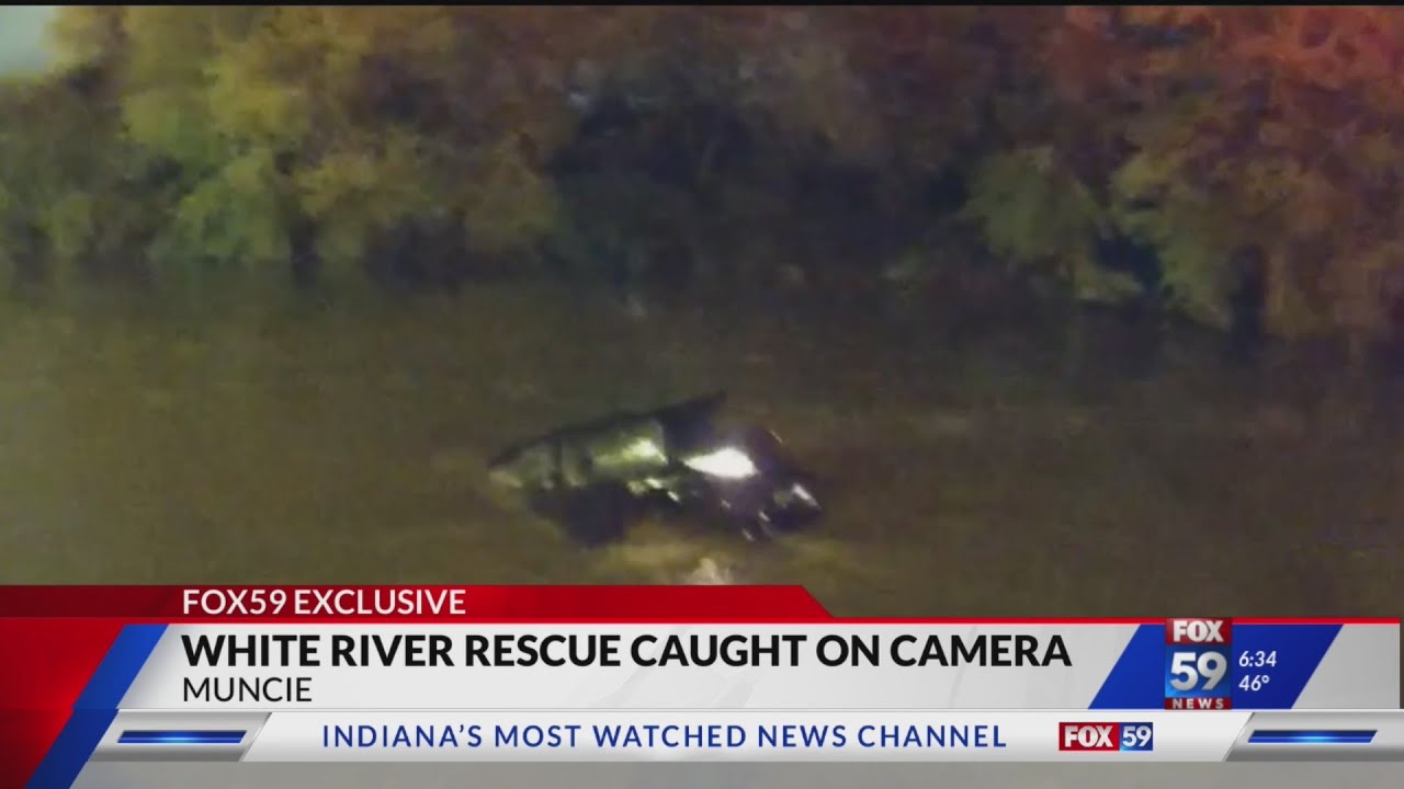 CAUGHT ON CAMERA: Officers jump into river, rescue woman from sinking car in Muncie