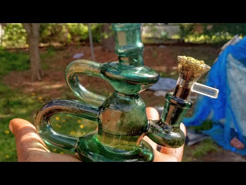 smoking pure indica chocolate Kush out of mini bong.