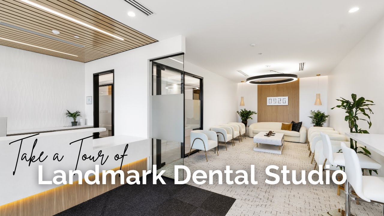 Dentist and patient with message Welcome to Landmark Dental Studio