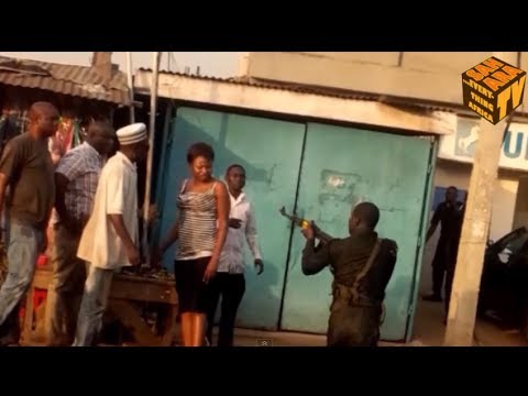 Drunk Nigerian Policeman Assaults Civilians